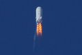 Blue Origin's second test vehicle, a suborbital launch vehicle, soars through Mach 1.2 at 45,000 feet in this image released by the secretive private spaceflight company. 