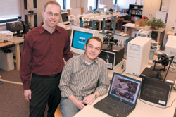 Graduate student Matt Heverly (ENG'05) (right), who came to BU to further study robotics and controls, and Pierre Dupont, an ENG associate professor of aerospace and mechanical engineering, who has recruited Heverly to a team developing technology for fetal cardiac surgery. Photograph by Vernon Doucette 